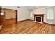 Living room featuring a fireplace, hardwood floors, and an open layout at 1783 Cloister Dr, Indianapolis, IN 46260