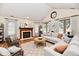 Bright living room featuring a fireplace, vaulted ceilings, and ample natural light at 1783 Cloister Dr, Indianapolis, IN 46260
