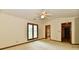 Spacious main bedroom with a ceiling fan and ensuite bathroom and large closet access at 1783 Cloister Dr, Indianapolis, IN 46260