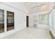 This bright sunroom is filled with natural light from many windows and features tile flooring at 1783 Cloister Dr, Indianapolis, IN 46260