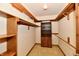 A well-organized walk-in closet boasts built-in shelving and drawers for maximum storage at 1783 Cloister Dr, Indianapolis, IN 46260
