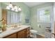 Inviting bathroom with wood cabinets, a marble countertop, and stylish fixtures at 1914 S Avon Ave, Avon, IN 46123