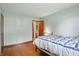 Bedroom featuring hardwood floors, a light paint color and a large bed at 1914 S Avon Ave, Avon, IN 46123
