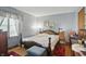 Comfortable bedroom with hardwood floors and bright natural light from the large window at 1914 S Avon Ave, Avon, IN 46123