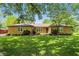 Traditional brick home featuring large front yard with mature trees at 1914 S Avon Ave, Avon, IN 46123