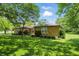 Charming single-story brick home featuring a lush green lawn and mature trees at 1914 S Avon Ave, Avon, IN 46123