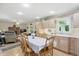 Open-concept kitchen flows into the living area and offers warm wood cabinetry and a dining table at 1914 S Avon Ave, Avon, IN 46123