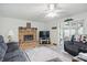 Cozy living room with a brick fireplace and view to the dining room at 1914 S Avon Ave, Avon, IN 46123