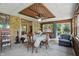 Bright sunroom features brick accent walls and a unique ceiling design with a ceiling fan at 1914 S Avon Ave, Avon, IN 46123