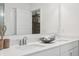 Bright bathroom offers dual sinks with a quartz countertop, a modern mirror, and elegant decor at 19652 Shadow Trace Path, Westfield, IN 46074