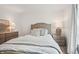 Cozy bedroom features a comfortable bed, bright window with outside views, and stylish furniture and decor at 19652 Shadow Trace Path, Westfield, IN 46074