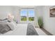 Bedroom features a comfortable bed, a bright window with outside views, and stylish furniture and decor at 19652 Shadow Trace Path, Westfield, IN 46074
