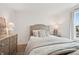 Cozy bedroom features a comfortable bed, bright window with outside views, and stylish furniture and decor at 19652 Shadow Trace Path, Westfield, IN 46074