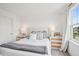 Cozy bedroom features a comfortable bed, bright window with outside views, and stylish furniture and decor at 19652 Shadow Trace Path, Westfield, IN 46074