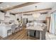 Elegant dining area featuring a chandelier, wood table with seating, and seamless access to the kitchen at 19652 Shadow Trace Path, Westfield, IN 46074