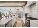 Spacious kitchen overlooking the living room with fireplace and built-in shelving at 19652 Shadow Trace Path, Westfield, IN 46074