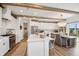 Bright kitchen features white cabinets, stainless appliances, and an island with seating at 19652 Shadow Trace Path, Westfield, IN 46074