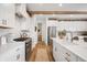 Well-lit kitchen with white cabinetry, marble countertops, and stainless steel appliances at 19652 Shadow Trace Path, Westfield, IN 46074