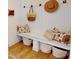 Mud room with bench and hooks, and storage baskets; pillows add decorative touch at 19652 Shadow Trace Path, Westfield, IN 46074