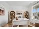 Bright home office with white walls, natural light, and stylish shelving for organized storage at 19652 Shadow Trace Path, Westfield, IN 46074