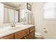 Bright bathroom with granite countertop, wooden cabinets, and stainless steel hardware at 2020 N Park Ave, Indianapolis, IN 46202