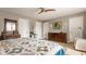 Charming bedroom with hardwood floors, ceiling fan, dresser, and quilt-covered bed at 2020 N Park Ave, Indianapolis, IN 46202