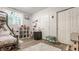 Functional bedroom with a lofted bed, desk area, white shag rug, and neutral walls at 2020 N Park Ave, Indianapolis, IN 46202