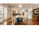 Bright dining room with an open layout, hardwood floors, and access to the kitchen at 2020 N Park Ave, Indianapolis, IN 46202