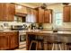 Spacious kitchen featuring custom cabinets, stainless steel appliances, and center island with seating at 2020 N Park Ave, Indianapolis, IN 46202