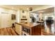 Open kitchen featuring a large island with built-in microwave and seamless flow to the dining area at 2020 N Park Ave, Indianapolis, IN 46202