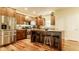 Kitchen with stainless steel refrigerator, range, and large central island with seating at 2020 N Park Ave, Indianapolis, IN 46202