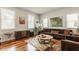 Comfortable living room with hardwood floors, ample light, and a vintage record player at 2020 N Park Ave, Indianapolis, IN 46202