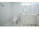 Bright bathroom with a modern vanity, stylish mirror, and white fixtures at 2159 W 58Th Nw St, Indianapolis, IN 46228