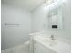 Modern bathroom with a sleek vanity, stylish mirror, and marble floor at 2159 W 58Th Nw St, Indianapolis, IN 46228