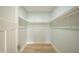 Walk in closet with modern organizers, wooden floor, and great storage space at 2159 W 58Th Nw St, Indianapolis, IN 46228