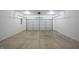 Clean garage featuring a concrete floor and ample space for vehicle storage at 2159 W 58Th Nw St, Indianapolis, IN 46228