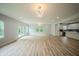 Spacious living room featuring hardwood floors, modern lighting, and an open floor plan at 2159 W 58Th Nw St, Indianapolis, IN 46228