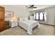 Comfortable bedroom featuring neutral carpet, a queen bed, and a bright window at 2442 N Willow Way, Indianapolis, IN 46268
