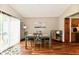 Bright dining area with sliding glass doors, neutral paint, and wood-look flooring at 2442 N Willow Way, Indianapolis, IN 46268