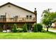Exterior elevation of home featuring a large deck overlooking the yard at 2442 N Willow Way, Indianapolis, IN 46268