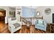 Cozy living room features wood floors, blue accent wall, and comfortable seating area at 2442 N Willow Way, Indianapolis, IN 46268