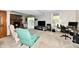 Large living room with brick fireplace, carpeted floor, and access to the backyard at 2442 N Willow Way, Indianapolis, IN 46268