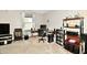 Office with a glass desk, rolling chair, shelving, and carpeted floor at 2442 N Willow Way, Indianapolis, IN 46268