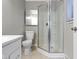 Bathroom featuring modern vanity, toilet and glass enclosed shower at 255 N Pasadena Rd, Noblesville, IN 46062