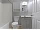 Bathroom featuring vanity, mirror, toilet and shower at 255 N Pasadena Rd, Noblesville, IN 46062