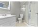 Bathroom featuring modern vanity, toilet and glass enclosed shower at 255 N Pasadena Rd, Noblesville, IN 46062