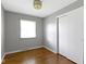 Bright bedroom with hardwood floors, closet, fresh paint, and a window at 255 N Pasadena Rd, Noblesville, IN 46062