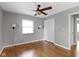 This cozy bedroom features hardwood floors, fresh paint, closet, and a window at 255 N Pasadena Rd, Noblesville, IN 46062