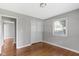 This cozy bedroom features hardwood floors, fresh paint, closet, and a window at 255 N Pasadena Rd, Noblesville, IN 46062
