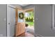 Bright home entryway showcasing natural light, wood floors, and a view of the landscaped yard at 255 N Pasadena Rd, Noblesville, IN 46062
